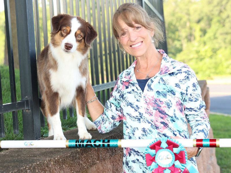 Spring with handler and her MACH bar. 